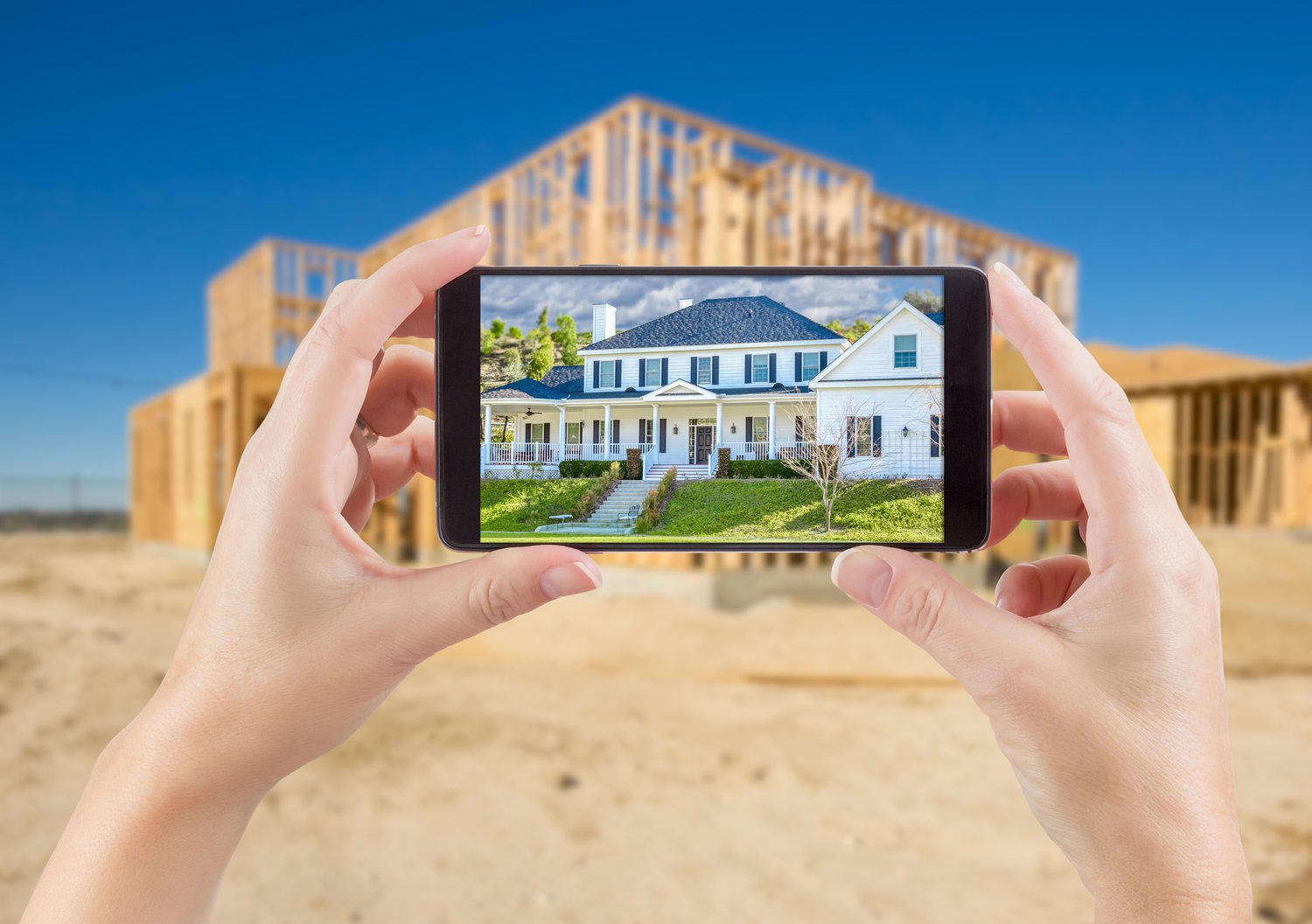 Female,Hands,Holding,Smart,Phone,Displaying,Photo,Of,House,With